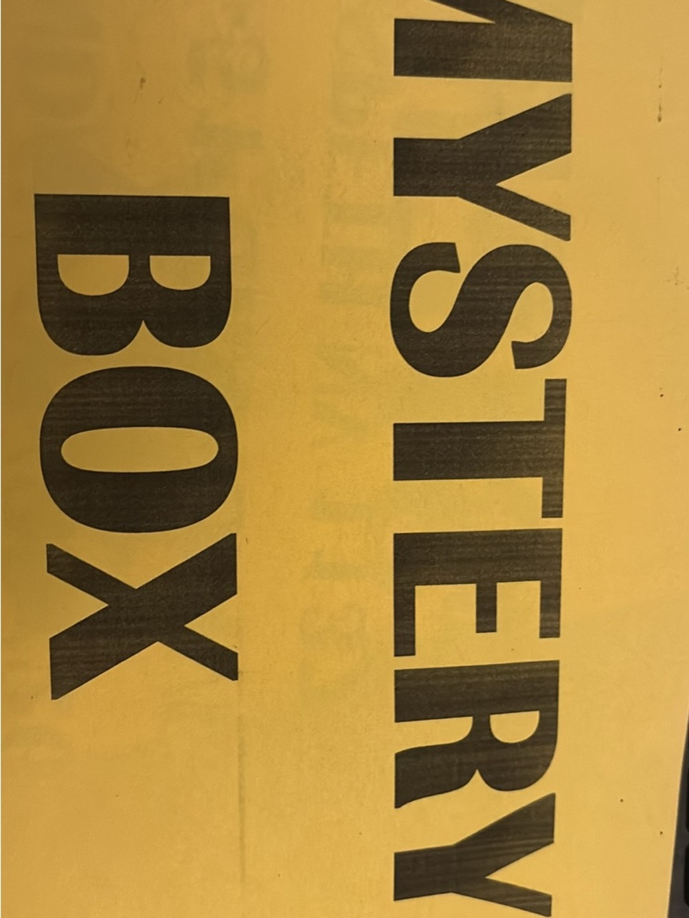 Mystery Yellow Box with Large Black Text